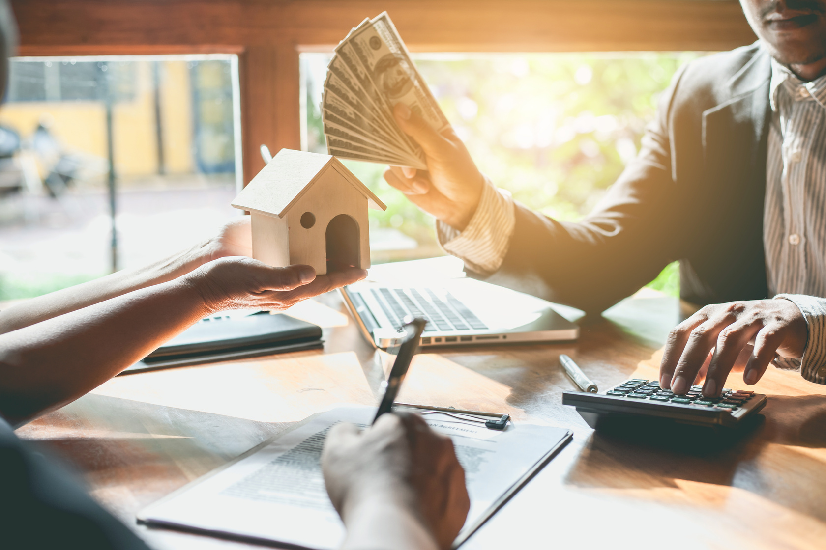 Business Signing a Contract Buy - Sell House.
